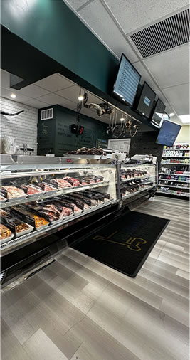 Refrigerated meat display case at the Brazmarket butcher counter
